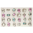 Assortment mother of pearl rings coloured